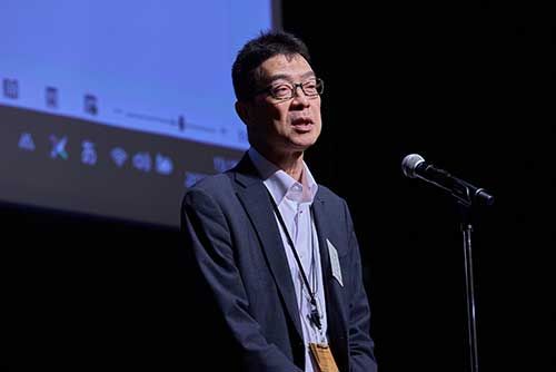 原田副会長壇上で話す
